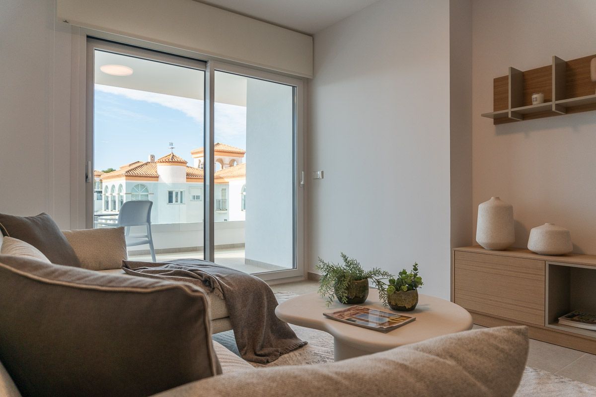 Wide-angle view of open-plan living area, La Zenia apartment
