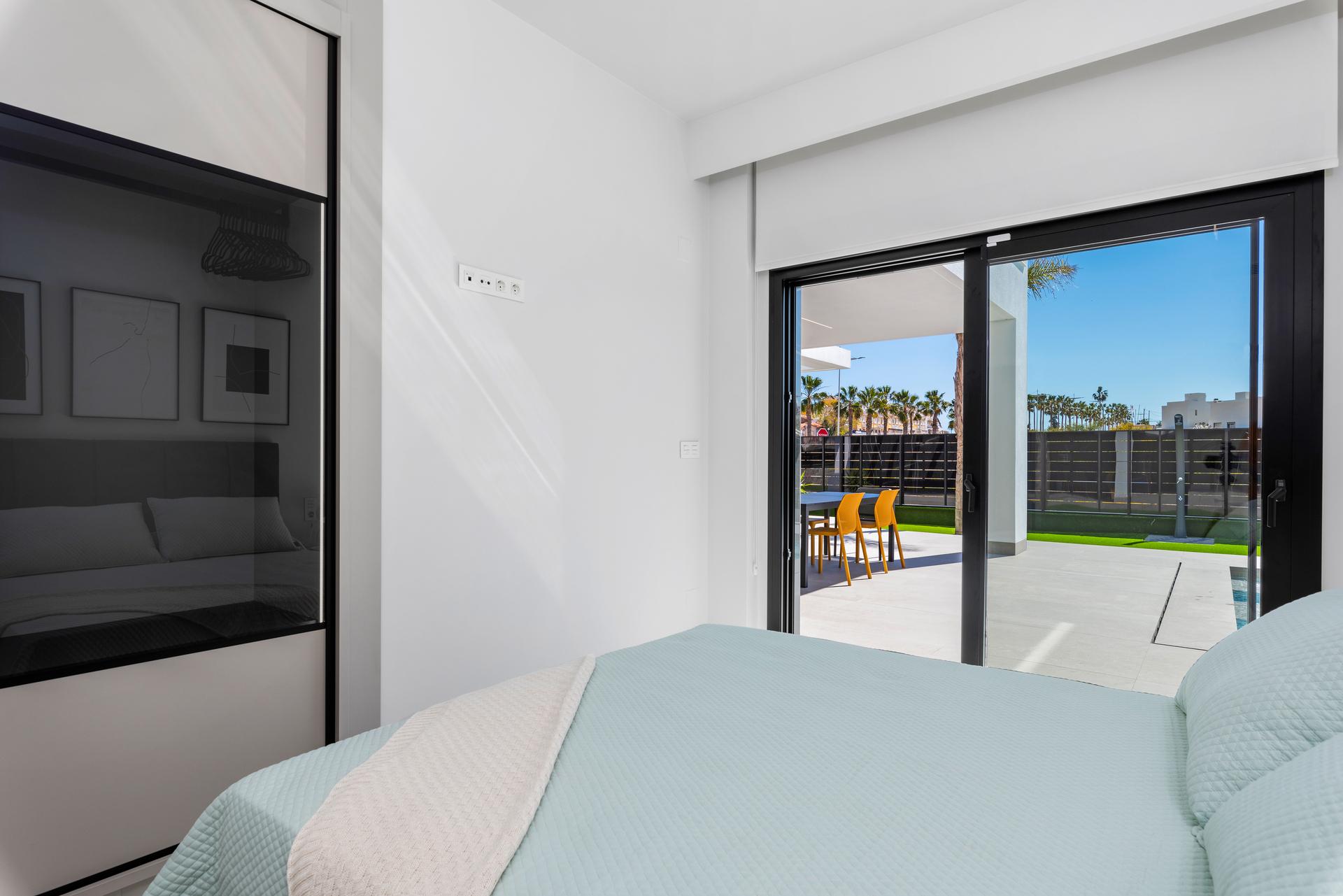 Rear garden view of new-build villa on 455m2 plot, Algorfa