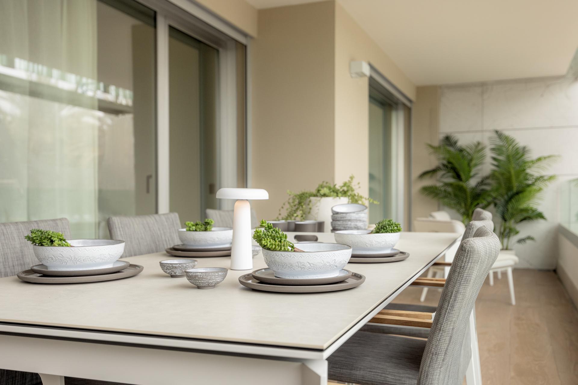 Terrace with tiled floor and glass balustrade, San Pedro penthouse