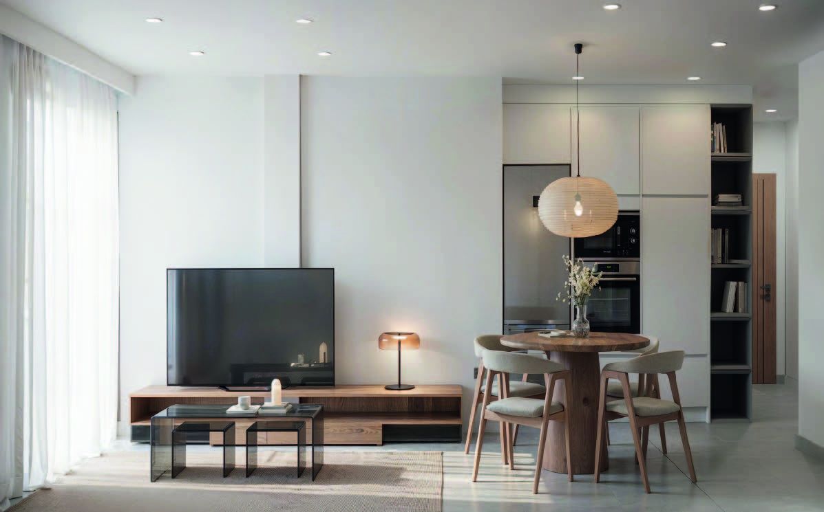 Open-plan living and dining area with large windows