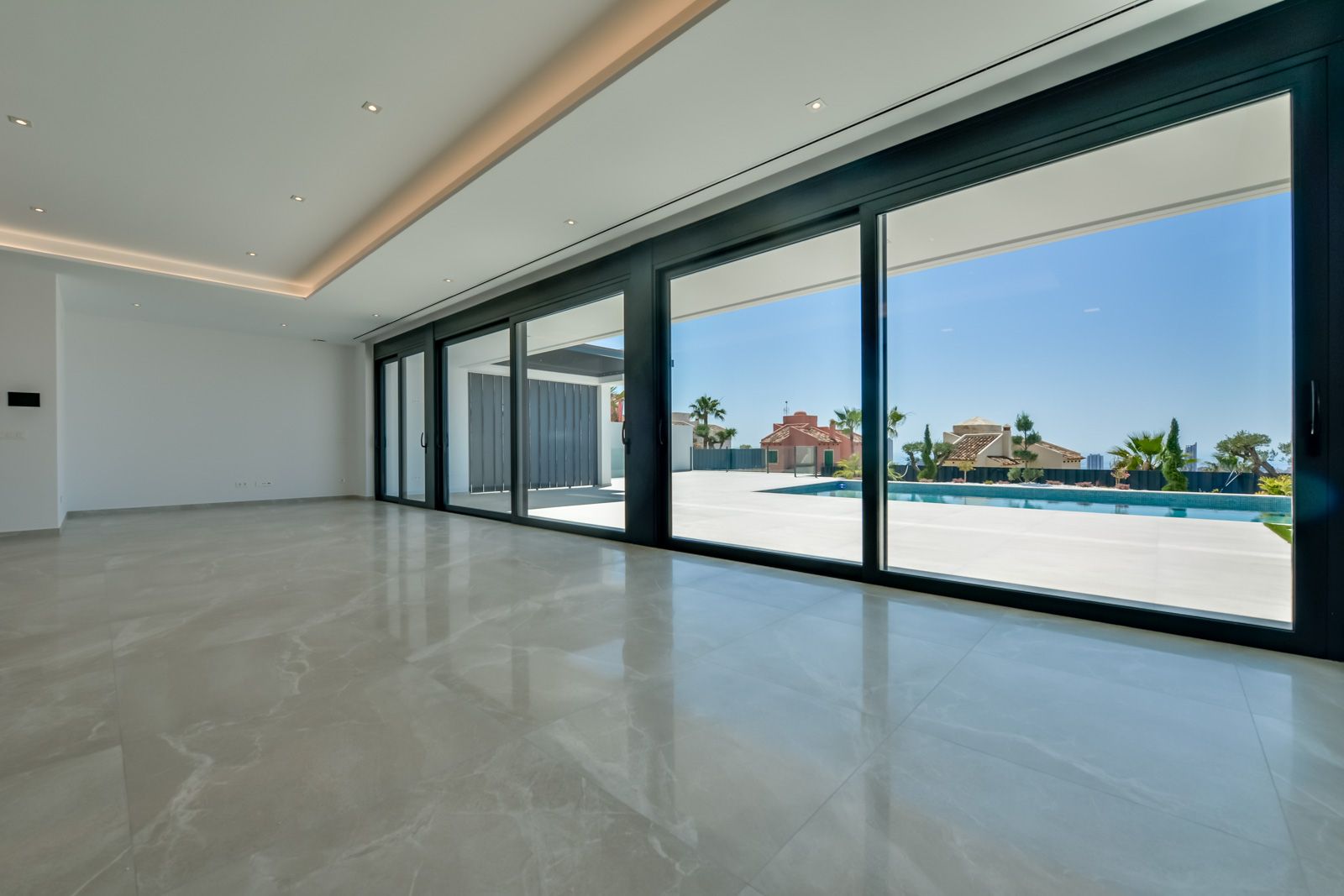 Lounge area with large windows in villa, Sierra Cortina, Finestrat