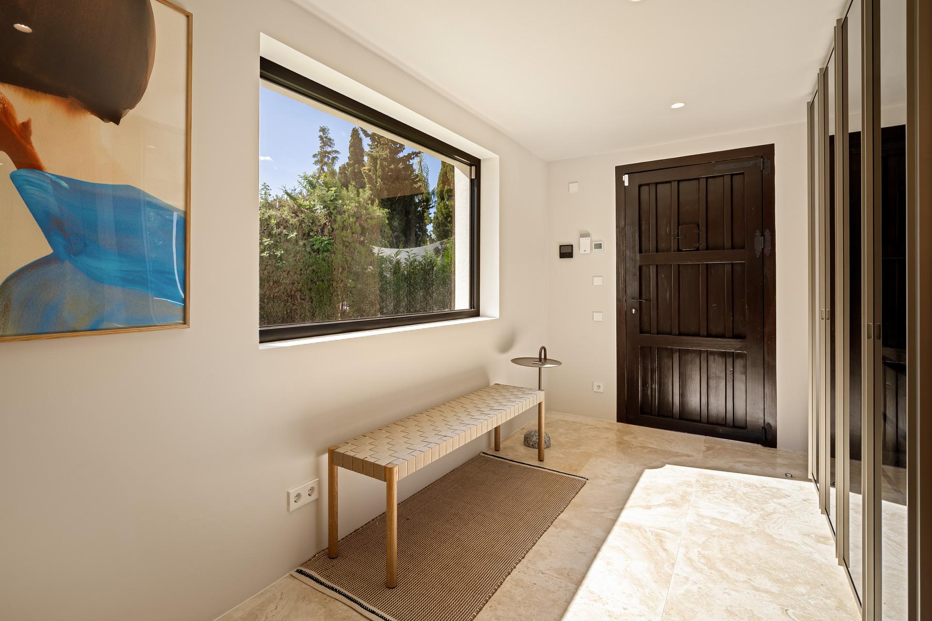 Outdoor lounge area beside pool, new-build villa, Puerto Banús