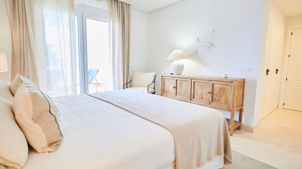 Communal garden and pool surrounds in La Cerquilla development, Marbella