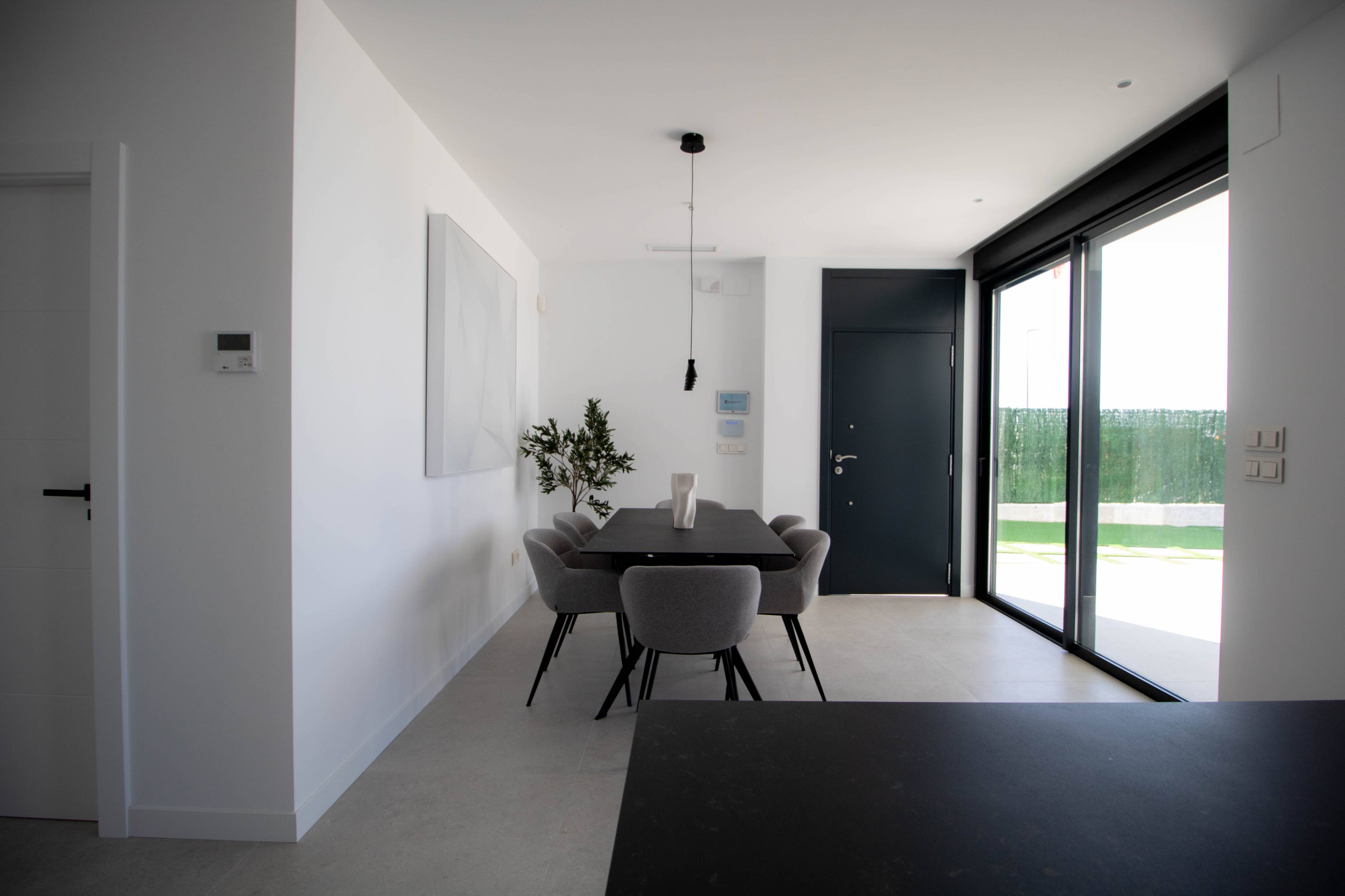 Exterior render of new-build villa at dusk, Golf Puig Campana