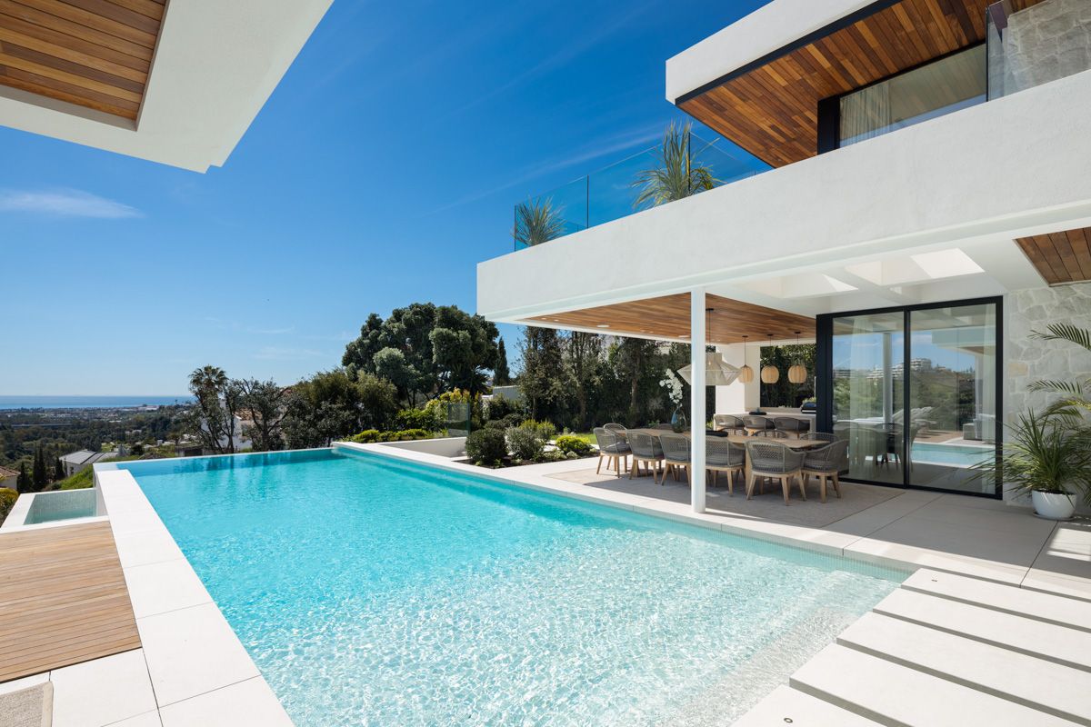 Exterior evening view of new-build villa, La Quinta, Benahavis