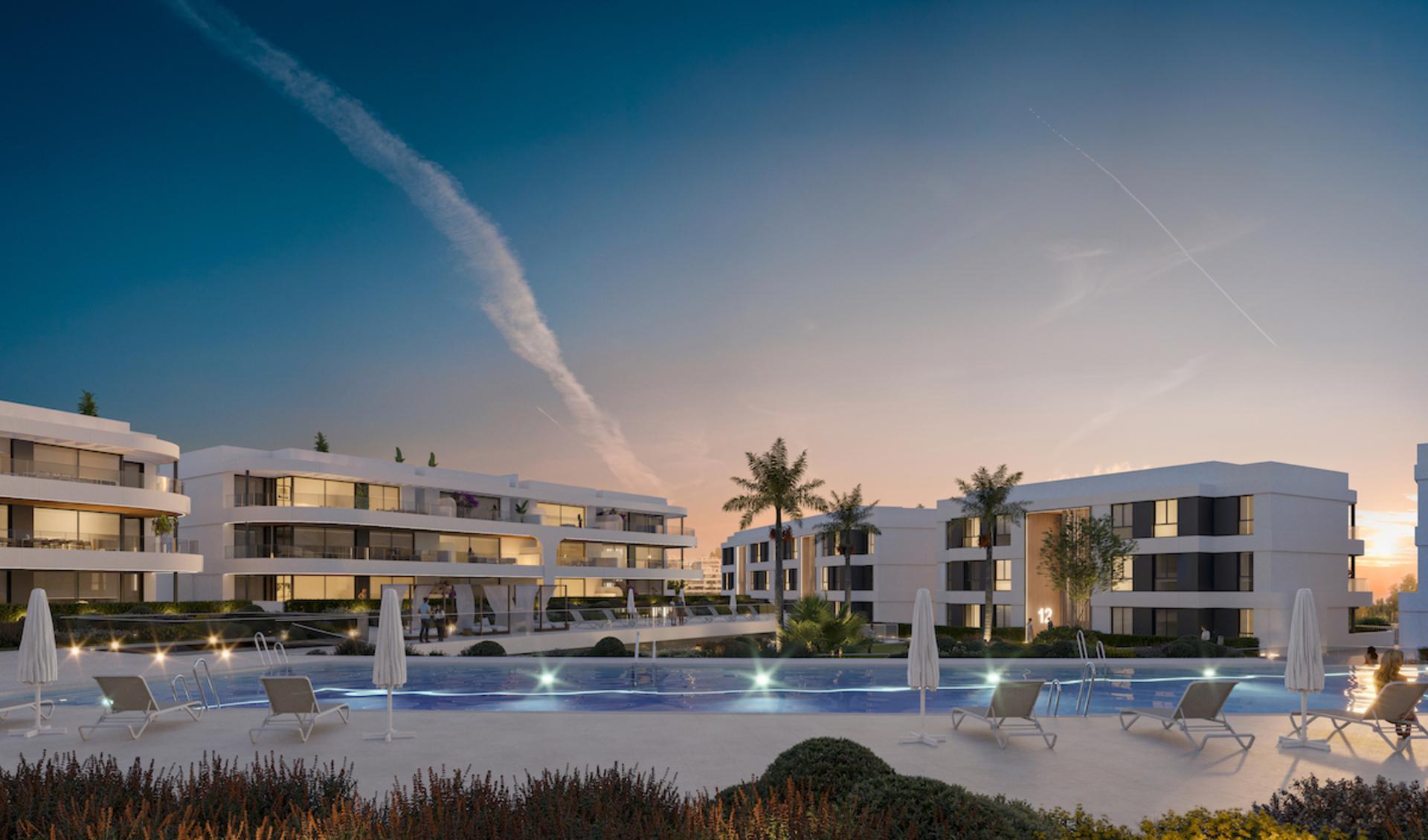 Communal pool and seating area at dusk, new-build development, Nueva Atalaya