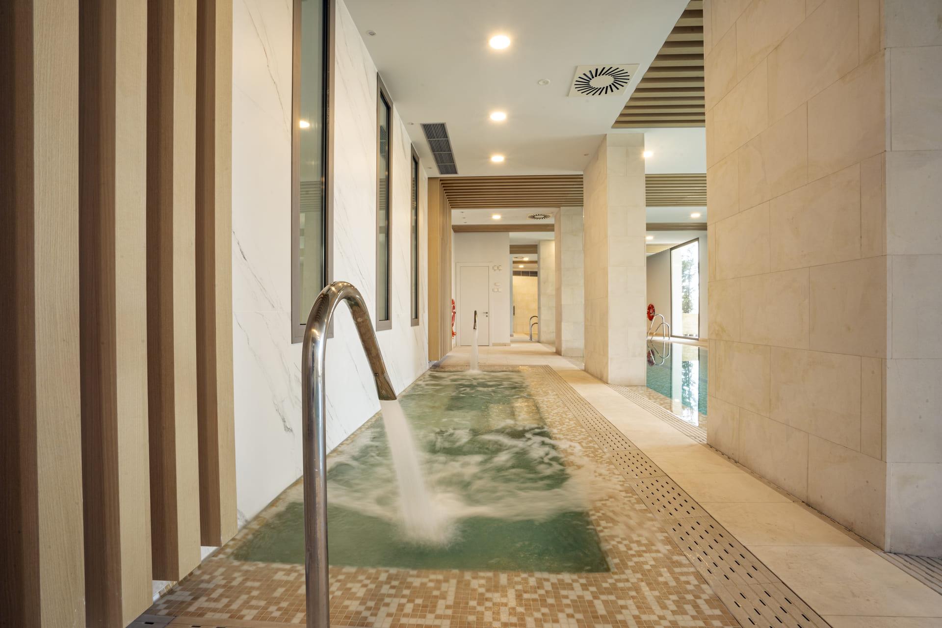 Master bedroom with floor-to-ceiling glazing in penthouse, La Quinta