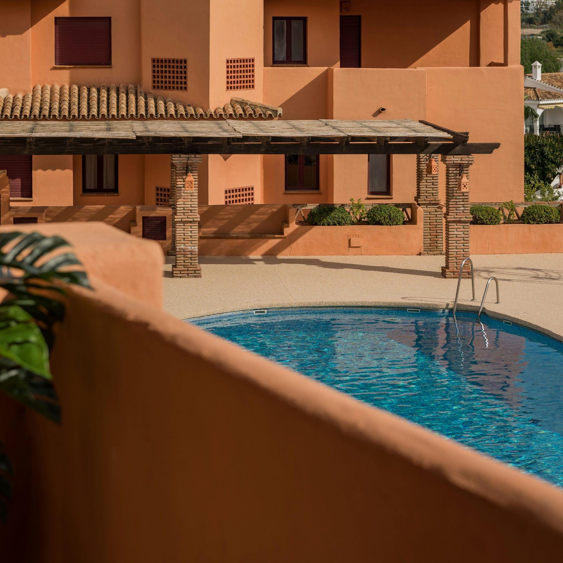 View of pool from apartment level, new-build development, Cortés