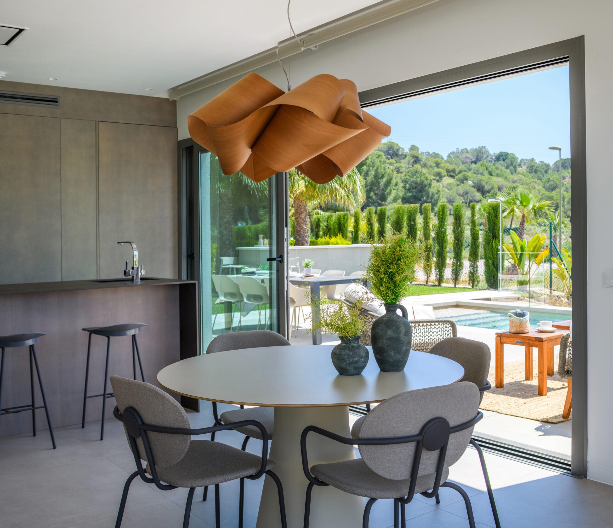 Outdoor dining area on terrace, new-build villa in Las Colinas Golf