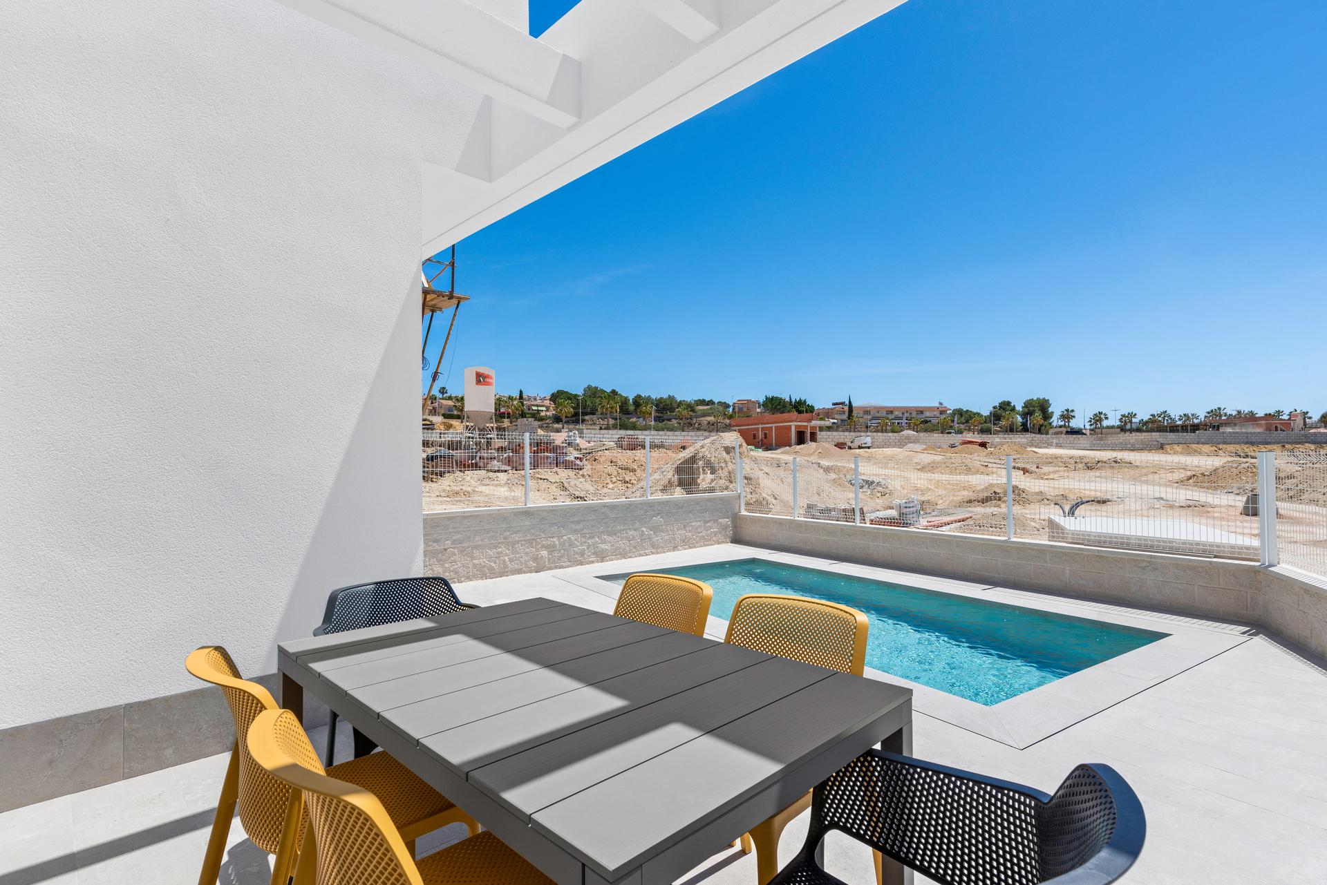 Gate and plot entrance of new-build villa in Algorfa