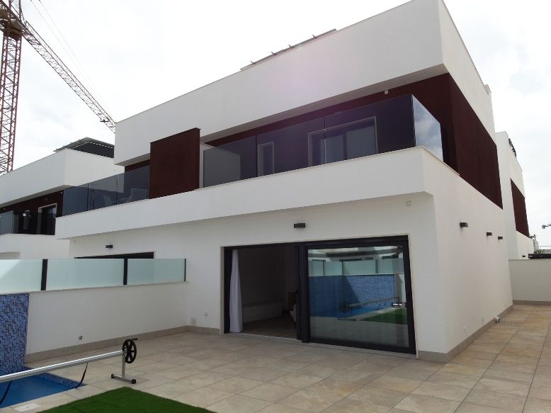 Exterior of townhouse unit showing plot boundary, Zona Pueblo, Pilar