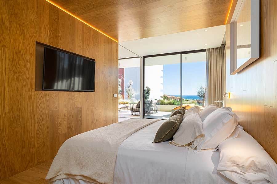 Lounge interior with recessed lighting, Reserva del Higuerón penthouse