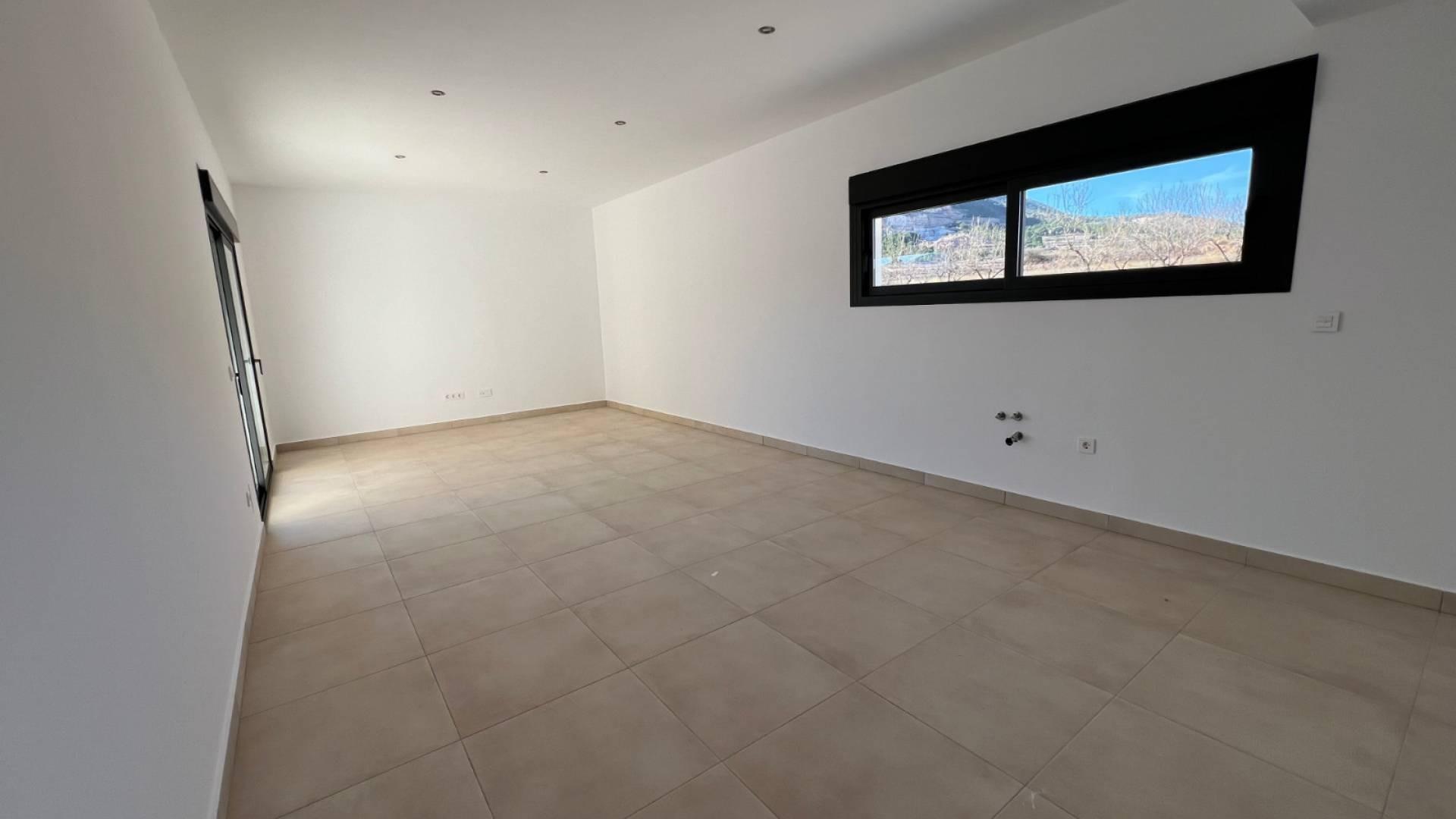 Window view from inside new-build villa looking out to plot, Hondón de las Nieves