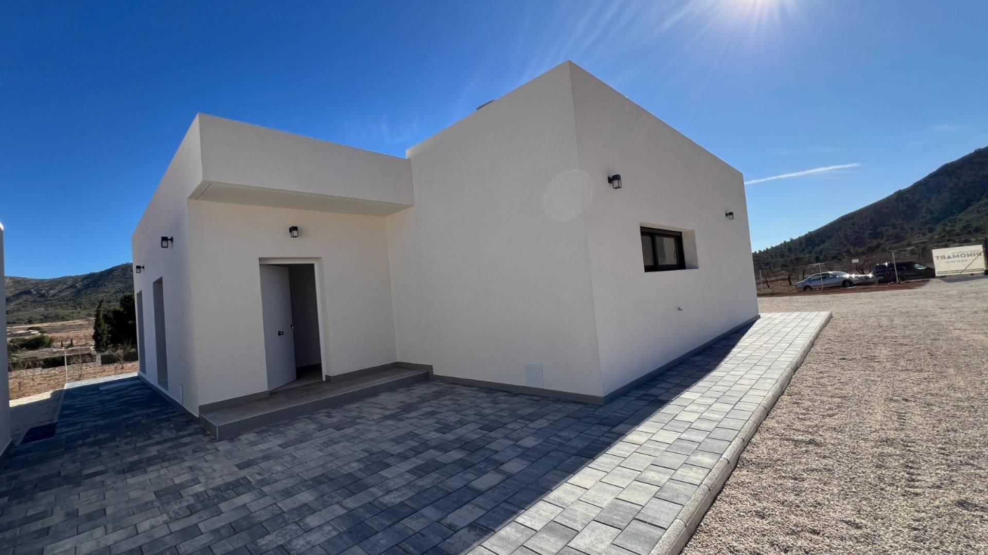 Plot surrounding new-build villa in Hondón de las Nieves showing open land