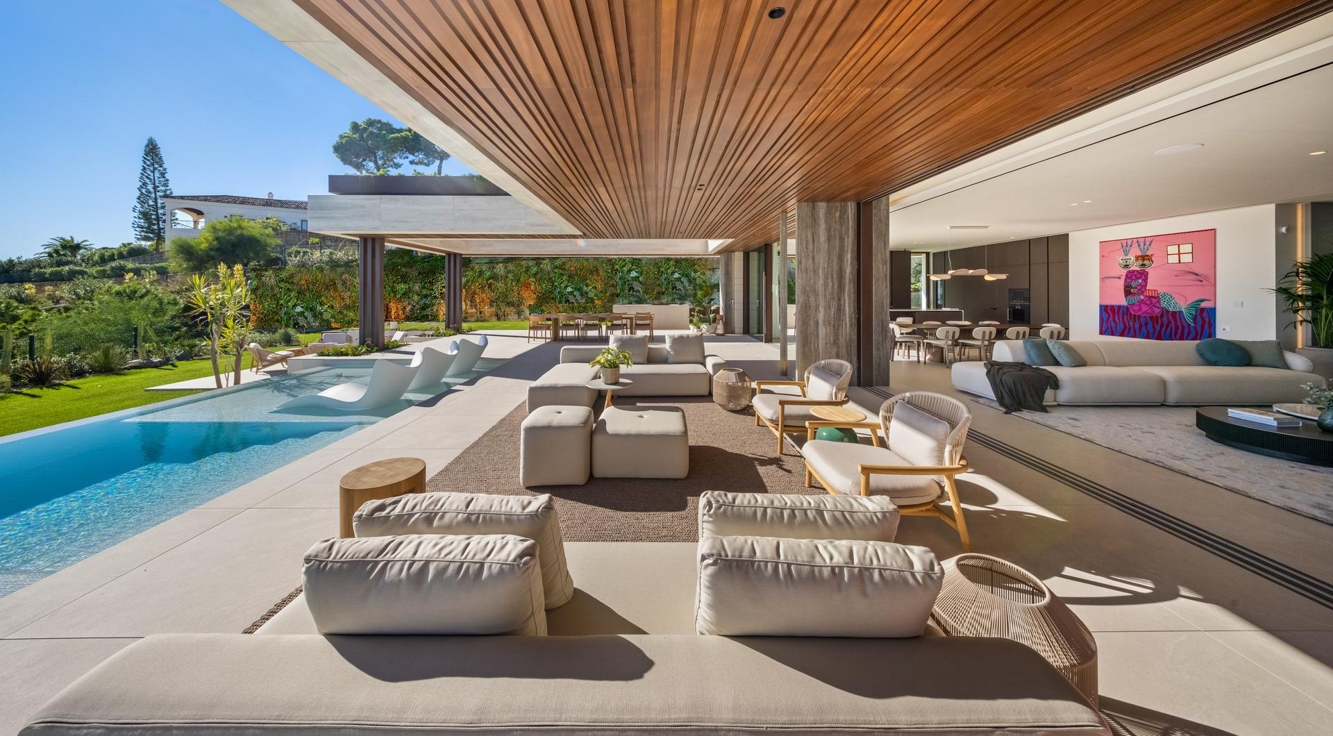 Exterior pool and terrace area at dusk, La Quinta, Benahavis