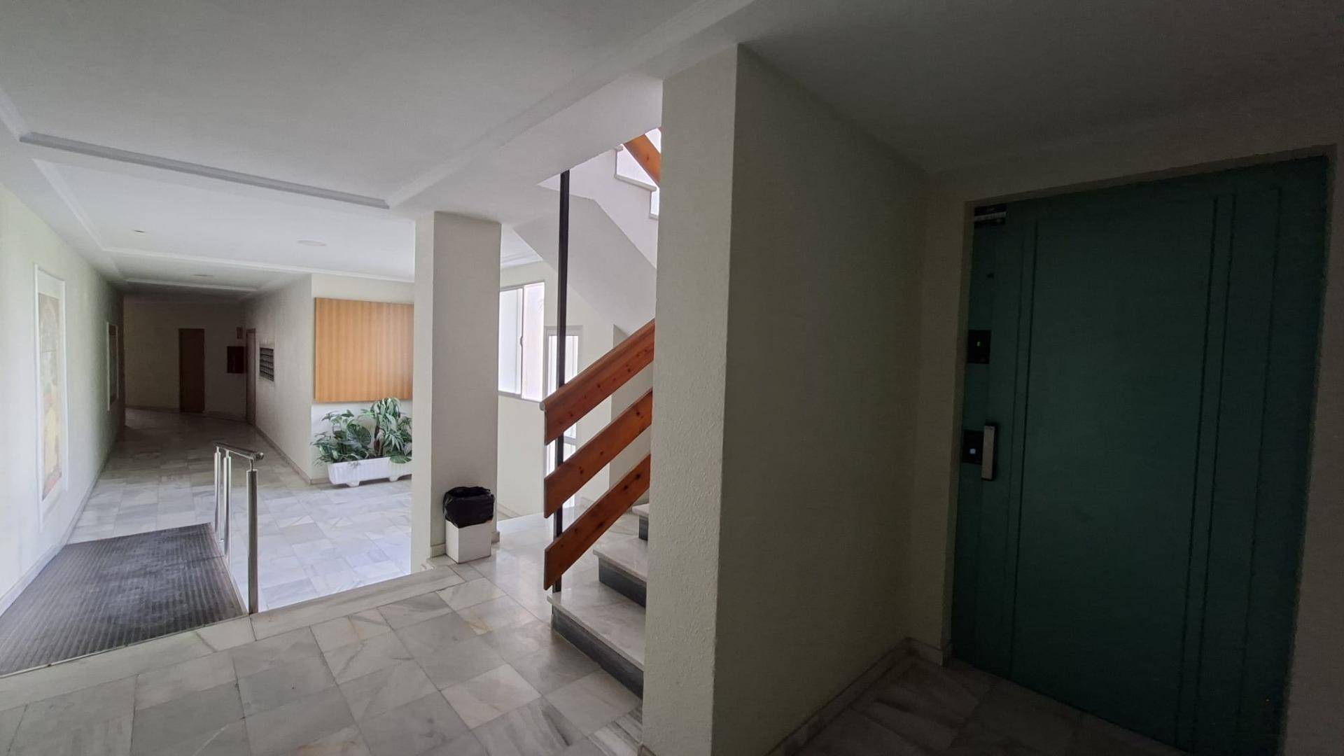 Building entrance and communal stairwell of beachfront block, Acequion