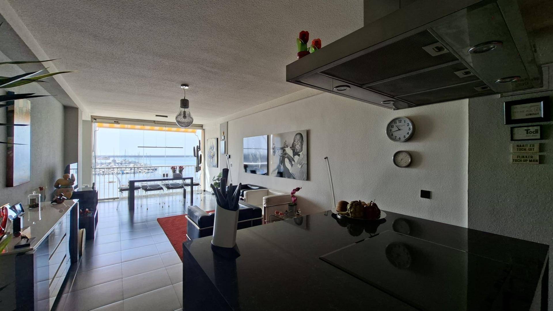 Double bedroom with window and furnished interior in beachfront apartment, Acequion