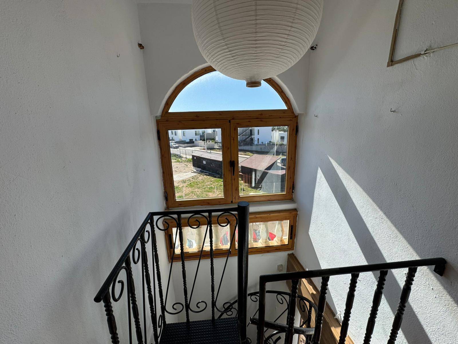Living room seating area with south-facing window