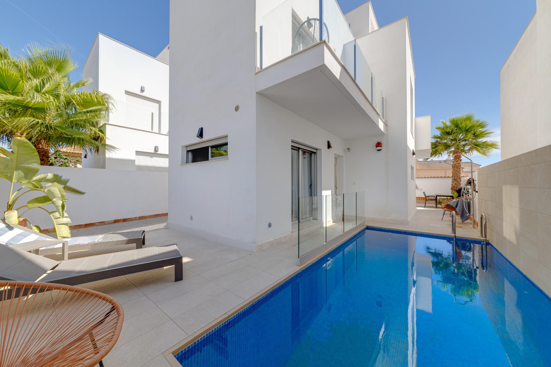 Open-plan living area with tiled floor and natural light
