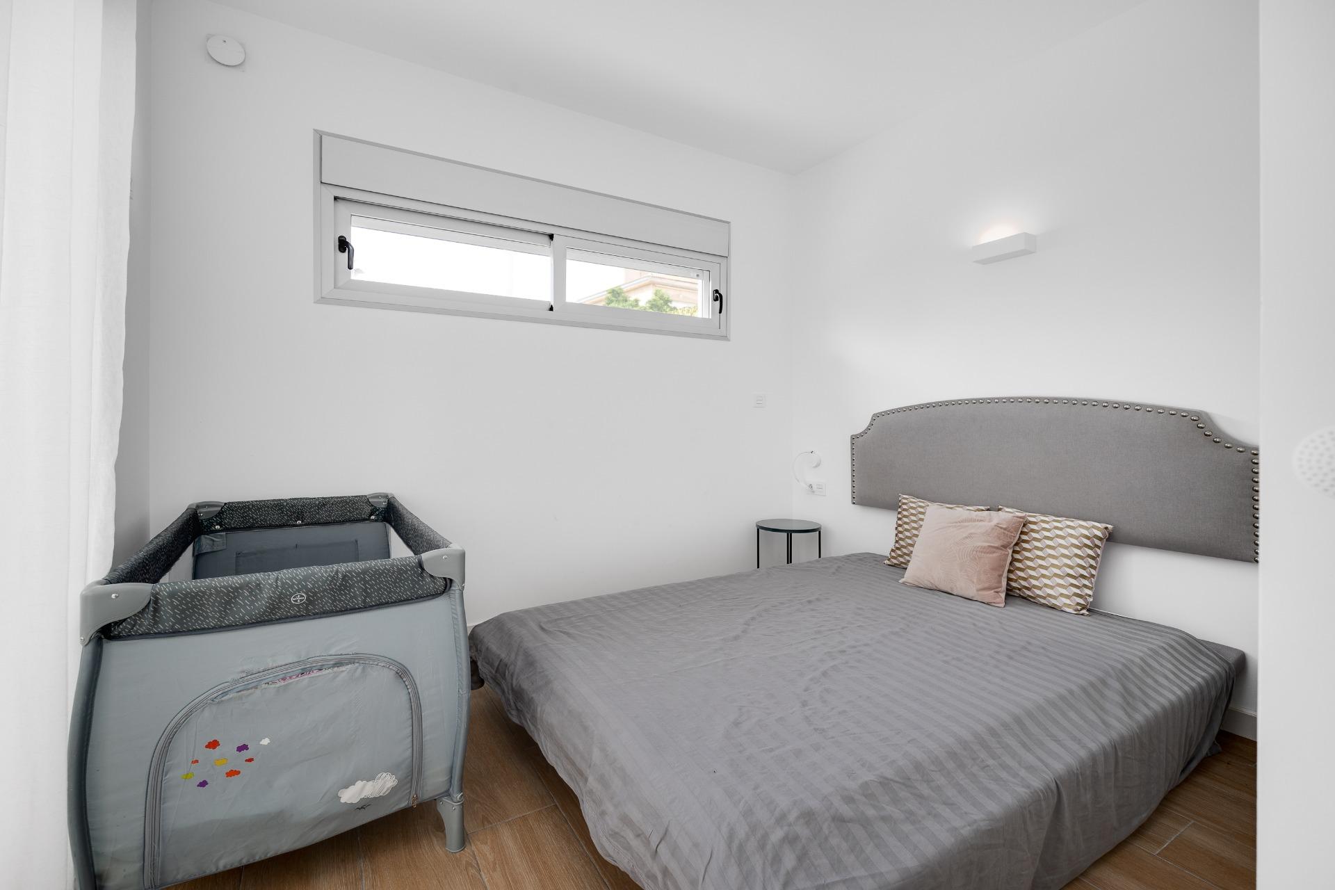Second bedroom with wardrobe and window