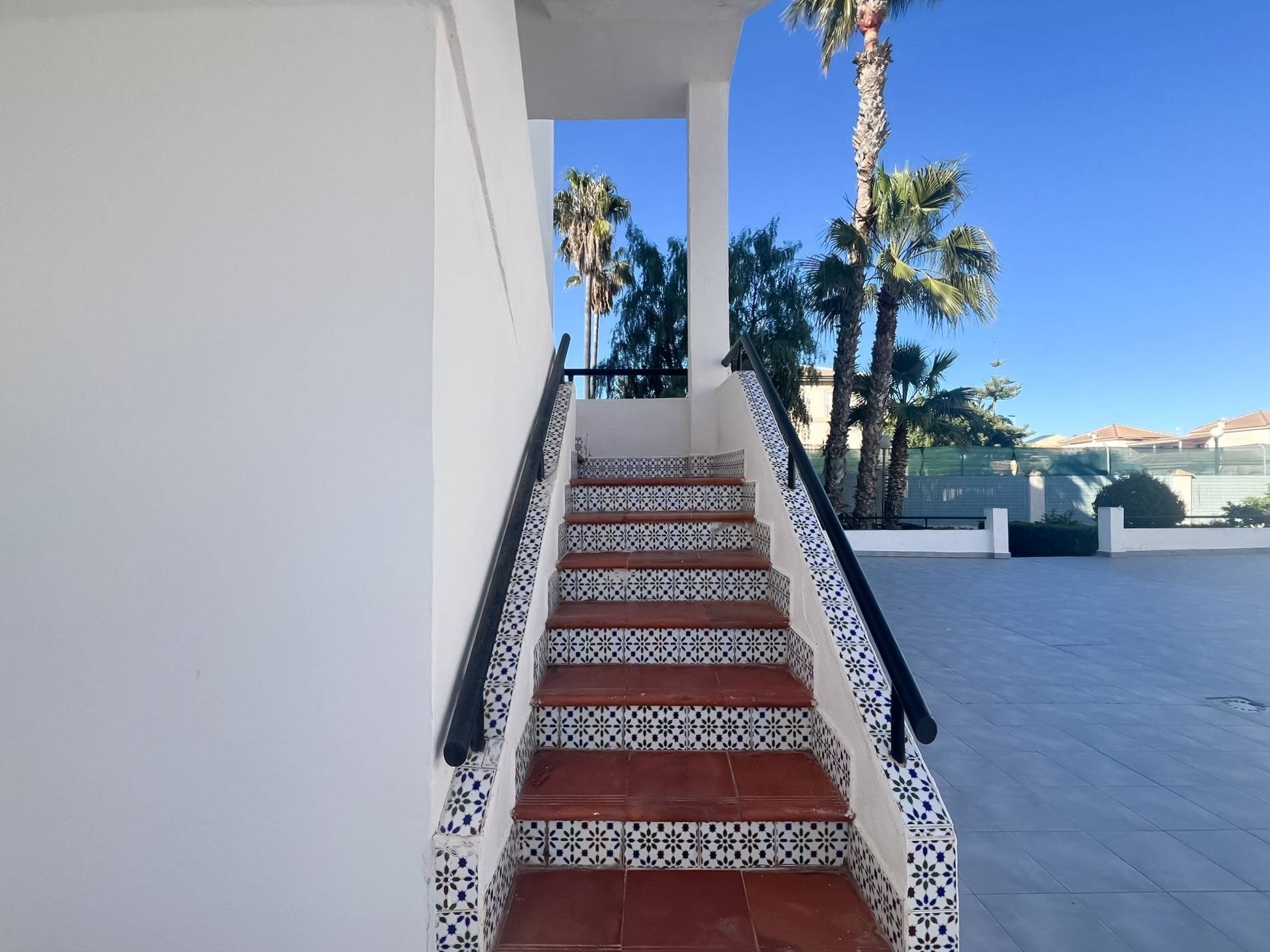 Private balcony overlooking the communal pool