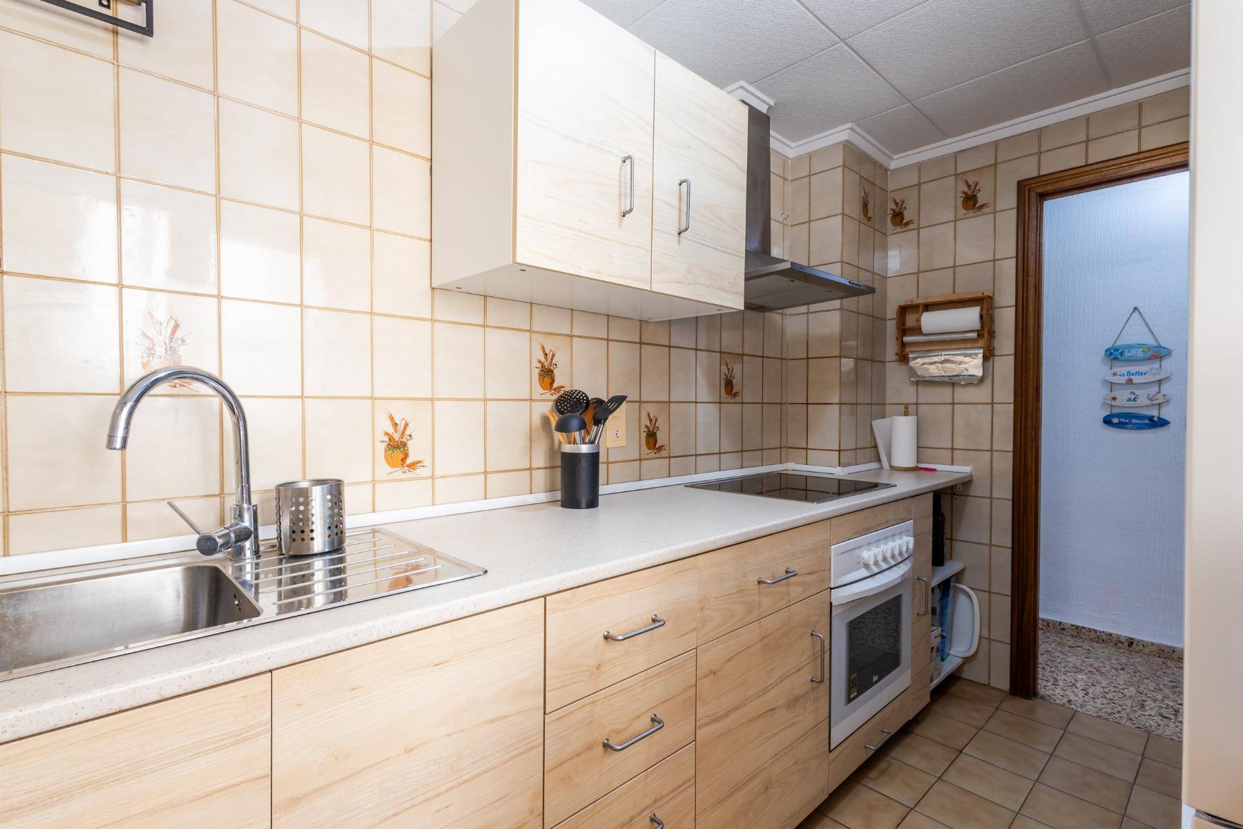 Utility and laundry room with plumbing connections