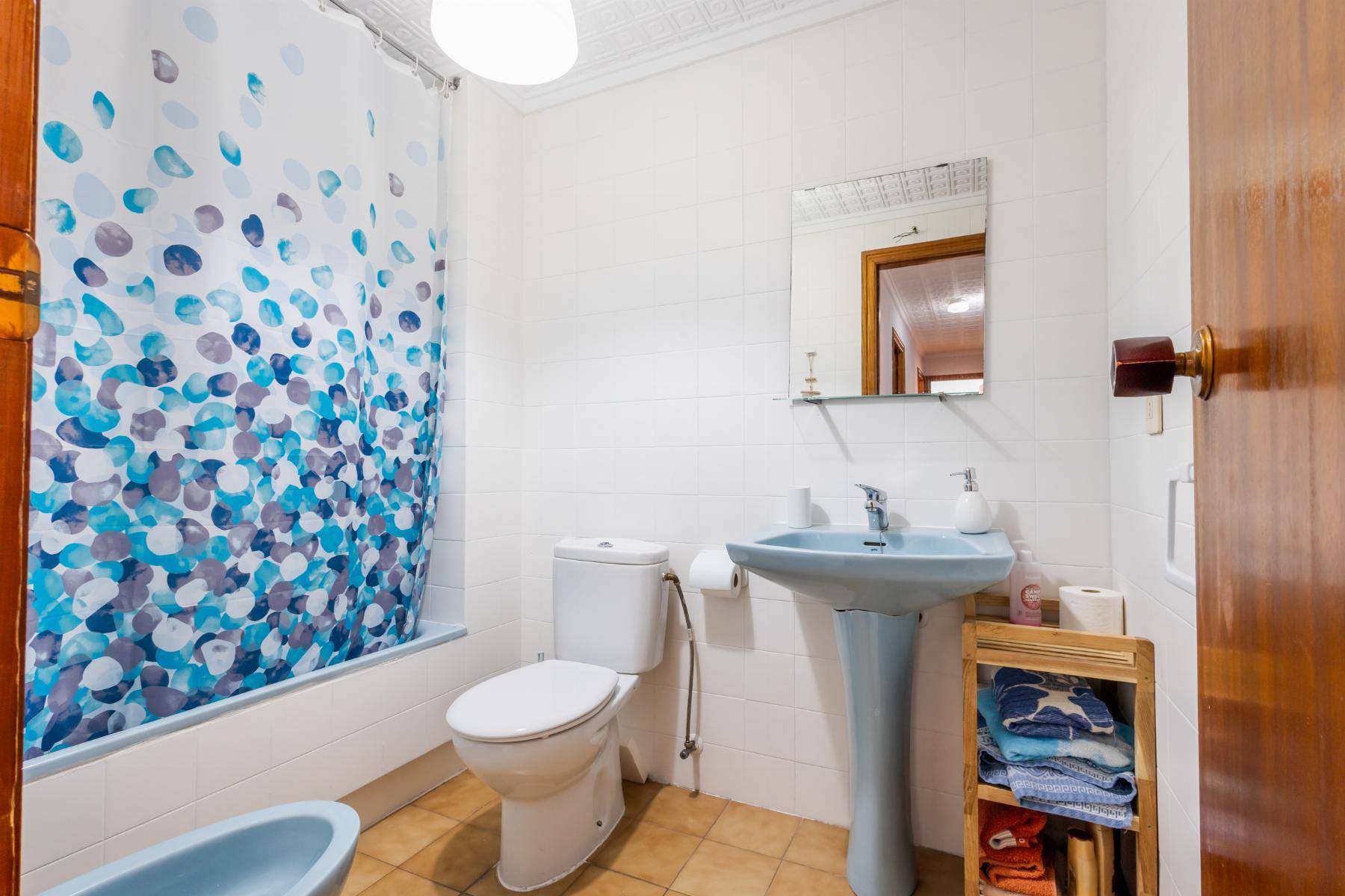 Second bedroom with window overlooking the street