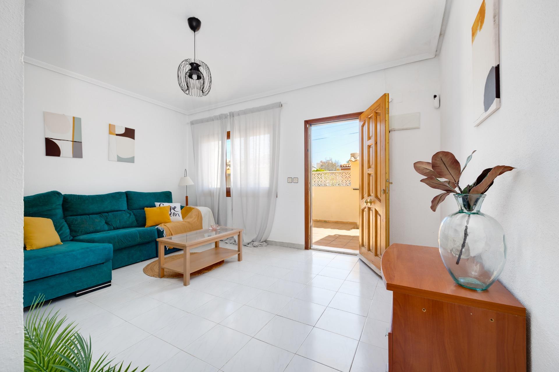 Living room on the ground floor with tiled flooring