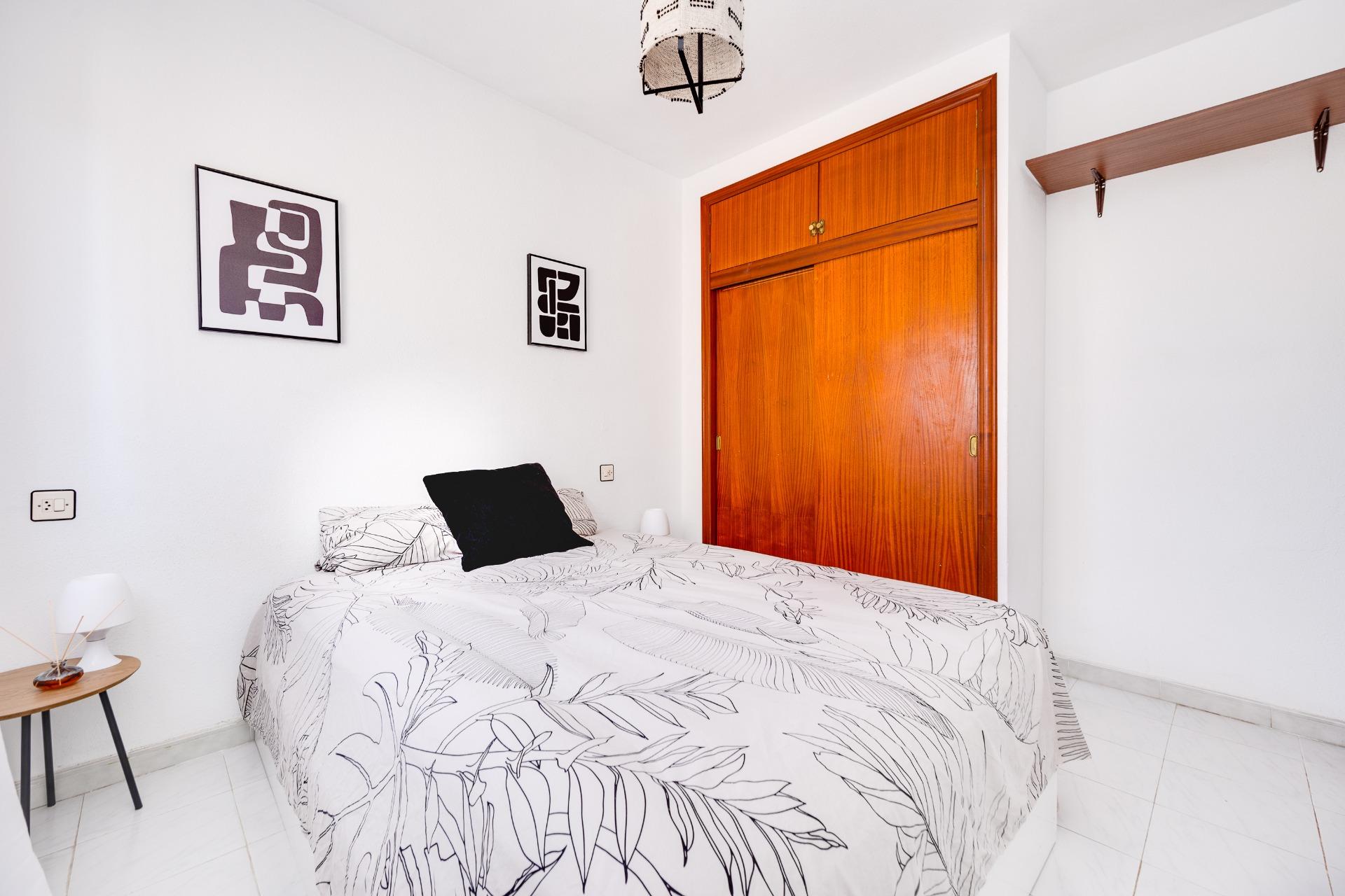 Bedroom with ceiling light and window