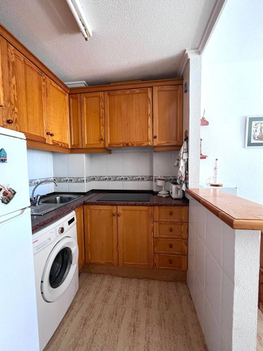 Kitchen area with fitted wall and base units in top-floor penthouse, Acequion