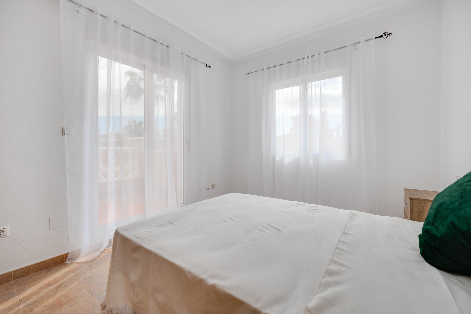 Bedroom window with roller blinds