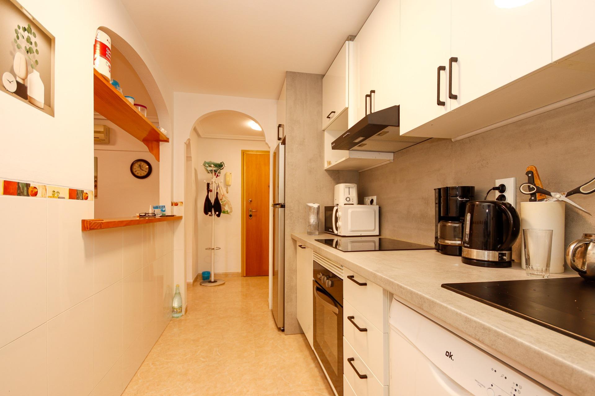 Bedroom window overlooking garden, ground-floor apartment, Playa Flamenca Norte