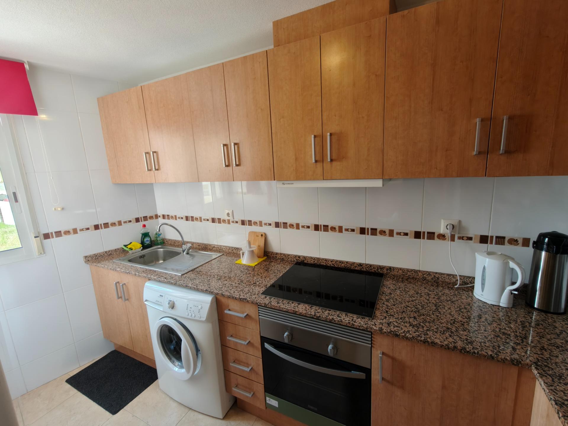 Kitchen worktop and cabinets in 2-bedroom apartment, Playa del Cura